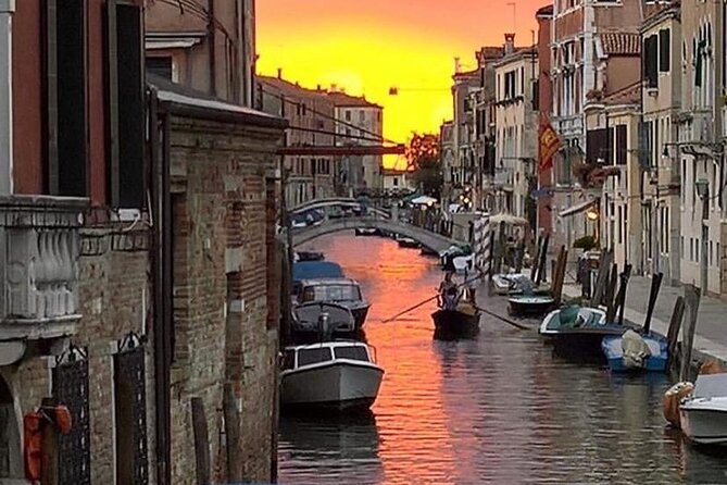 Aperitif at sunset in the Venice lagoon on a private boat. - Arsenale di Venezia: shipbuilding power behind the lagoon walls